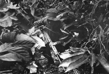 A photograph of Platoon strength N.W. 1ATF 'Operation Atherton' 1 Platoon, A Company, 8 RAR under heavy machin gun, AK47, rifle and RPG fire.  