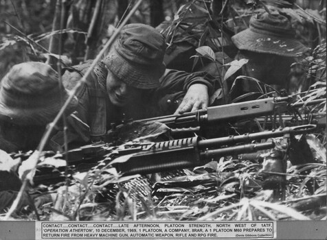 A photograph of of Platoon strength N.W. 1ATF 'Operation Atherton' , 1 Platoon, A Company, 8 RAR, a Platoon M60 prepares to return  fire. 