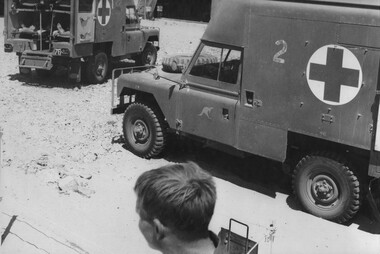 A photograph of Ambulances at the 1st Australian Field Hospital, Vung Tau, loaded with wounded diggers waiting to be driven to Vung Tau Airfield. 