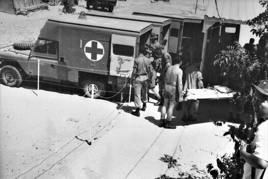 A photograph of Ambulances at the 1st Australian Field Hospital, Vung Tau, being loaded with wounded diggers to be driven to Vung Tau Airfield. 