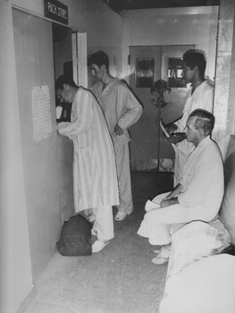 A photograph at 1st Australian Field Hospital, patients ready for discharge attend the hospital pack store to collect their personal belongings. 