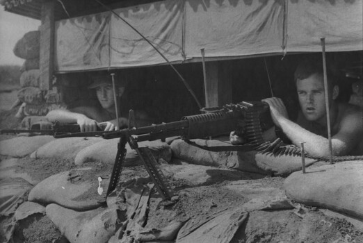 At 131st Divisional Locating Battery, 1st Field Regt RAA. Gnr Cahill mans an M60 MG while his number two is at the ready. 