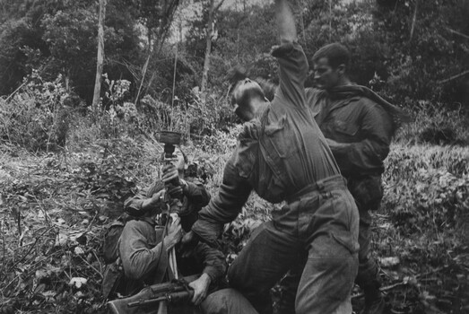 A photograph of Diggers from 1 Platoon, A Company, 8 RAR on Operation Atherton, 11 miles North West of the Australian Task Force Base.