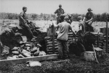 A photo of a newly established Fire Support Base, gunners are busy with the construction of ammunition and protection bunkers within the gun bay. 