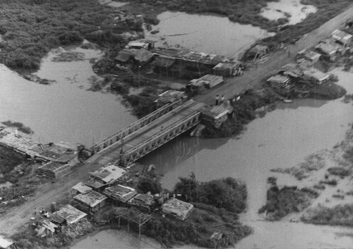 A  photograph of a series of South Vietnamese Regional Force heavily sandbagged outposts on Vietnams National Route 23.