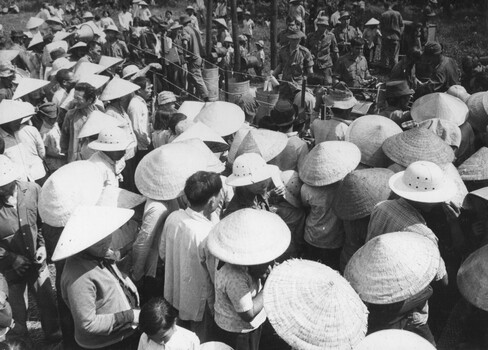 A photo of 5th Battalion, RAR diggers prepare meals for Binh Ba villagers awaiting interrogation and identity checks, during the cordon and search Operation Bondi.