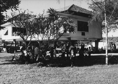 At the French owners house at a rubber plantation, staff and workers await their turn to be interrogated and undergo identidy checks during Operation Bondi.