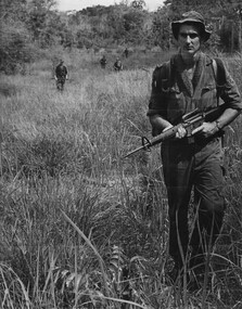 Jack Higgins batman to the Comp Comd Maj Jake O'Donnell  A Coy , 7 RAR moves through the foothills of the Nui Nghe monutains. 