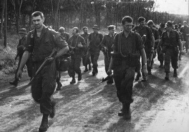 A photo of the batman Pte Jack Higgins, A Coy, 7 RAR files back into lines upon return to the 1 ATF Base.