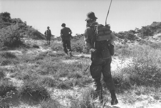 Military Police conduct a last light TAOR (Tactical Area of Responsibility) patrol aroundthe 1st Logistics Support Base at Vung Tau.