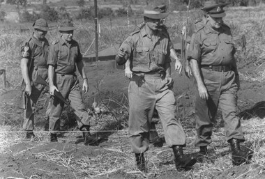 Members of the Pte Peter A. Allen of 9 RAR Court Marshall Board being escorted by a MP to the murder scene. 