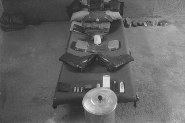 A photo of the regimentation, discipline and order required of a prisoner, in his cell, when confined to Australian Forces Vietnam Detention Barack. 