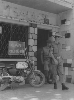 A photograph of Australian and New Zealand Military Police leave the Palace Bar following and inspection for unauthorised trading practices, particularly alcohol sales.