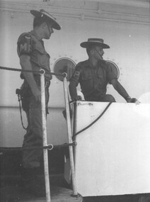 Two MP's on security and protection duty on board a Navy Supply vessel tied up at the wharf at Vung Tau Harbour.