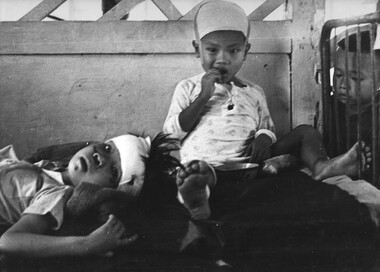 Children suffering schrapnel wounds are nursed at Long Xuyen Hospital, under the care of an Australian Civilian Surgical Team.