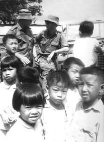 Lt Phil Hills, CO the 1st Australian Field Hygiene Unit discusses his tactics with an ATF Intelligence Officer at Long Dien Village.