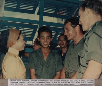 Photograph, A linguist from 1st Australian Civil Affairs Unit stationed at the 1st ATF Base Nui Dat condusts a mixed adult English class for Vietnamese at Baria