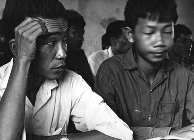 Two Vietnamese attand an English class at Phuoc Tuy Province headquarters compound situated at Baria. 