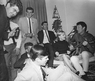 A photograph taken in Townsville of Rock and Roll stars Little Pattie and Col Joye entertain in the lounge of a private home. .