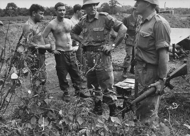 Brig Stewart Weir MC, 1st Australian Task Force Commander talks to Engineers at a second bridge on Vietnam's National Route 23. 