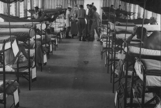 Medical ward at 1st Australian Field Hospital has its capacity doubled using double beds to accommodate the sick during an outbreak of malaria. 