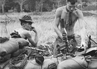 Mortar Platoon members of 4 RAR/NZ,  Pte M.P.McAuley, Pte R.A.Penny check the claymore lines and clean the M60 machine gun on the 1st ATF perimeter.