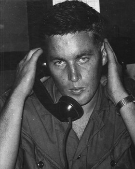 Sgt Fred Roberts, 3rd SAS Squadron, 1st ATF Base makes a telephone call to Australia to tell his wife of the award of the DCM.