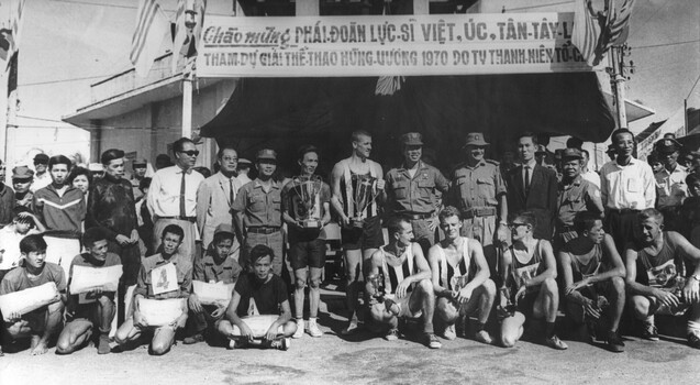 A Group photo of the placed runners in the 5000 metre footrace from the market place at Long Dien run on the Vietnamese National Day.