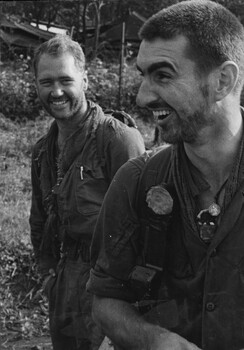 Pte Jack Higgins peeling an orange enjoys a joke with Maj Jake O'Donnell MC, A Company, 7 RAR upon return to 1st ATF Base.