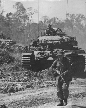 Diggers from 2 Platoon with 2Lt Molnar A Coy, and Maj. Kim Patterson, move out with the support of C Squadron, 1st Armoured Regiment. 