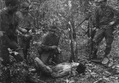 A wounded VietCong soldier lying on a track where he fell after endeavouring to escape from D Coy 6 RAR/NZ (ANZAC) during Operation Lavarack.