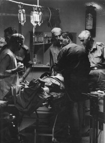 A photograph taken at the 1st Australian Field Hospital, of the resuscitation team in triage prior to surgery. 