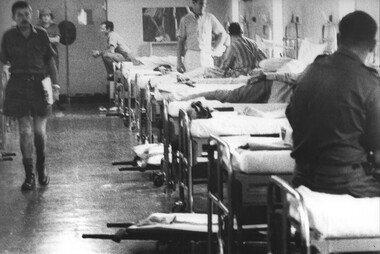 Patients at 1st Australian Field Hospital wait to be moved by stretchers to be loaded into ambulances for the ride to Vung Tau Airfield. 