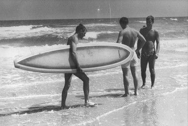 Diggers enjoy a break at Back Beach, for some the surf was inviting for the odd one the thrill of riding the waves. 