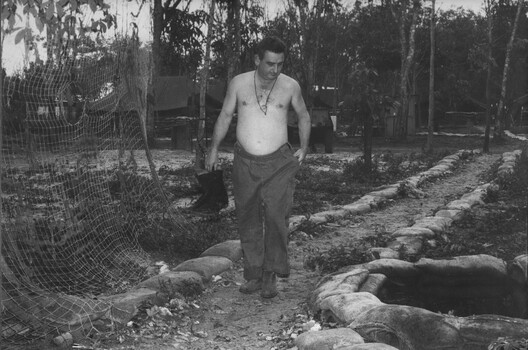 In a monsoonal rain squall at 1st ATF Base Capt Jack (The Quack) Blomley, makes the short walk. 