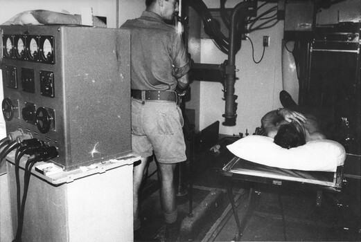 At the 1st Australian Field Hospital, X-Ray Sgt prepares a digger for an X-Ray. The facilities within the hospital were first class. 