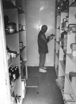 Medic Tony Thomas checks operating theatre stores following a day of operations on diggers  at the 1st Australian Field Hospital. 