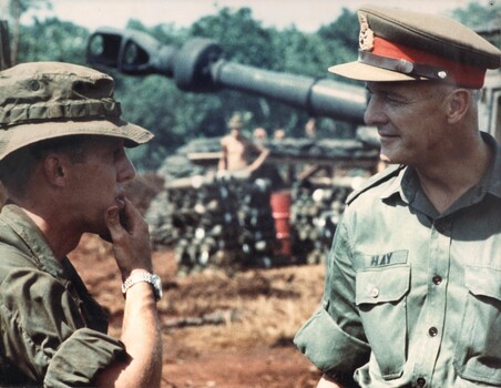 Maj Gen R.A. Hay, The Commander, Australian Force Vietnam, talking with the Officer Commanding from A Battery 2/35th United States Artillery.