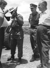 Maj Gen Doug Vincent and a visiting NZ politician watch as the Battery Commander 161 Battery Royal New Zealand Aartillery.