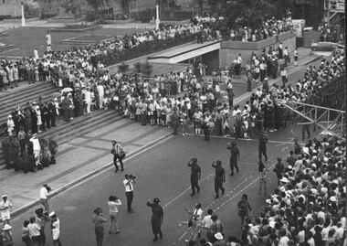 Diggers of 8th Batt, RAR led by Lt Col K.J. O'Neill DSO march through Brisbane, through a paper streamer welcome past the City Hall