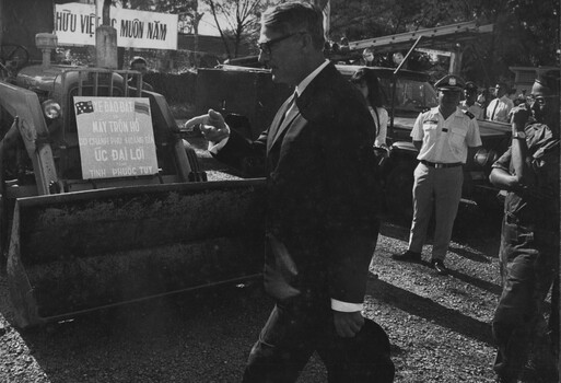 The Australian Ambassador to South Vietnam Mr Ralph Harry inspects a front end loader at the Phuoc Tuy Province Capital, Baria. 