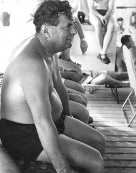 Capt "Nobby" Clarke enjoys a jazz concert given by the ship' band as the HMAS Sydney makes its way towards Vietnam.