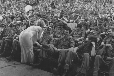 Despite a monsoonal downpour the Diggers of 1st Australian Task Force Base Nui Dat Luscombe Bowl endured the rain to enjoy Lorrae Desmond. 