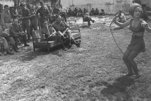 Members of AATTV assemble on ANZAC Day 1970 in Danang enjoy Erica De Wit, lead singer of the Official Apr-May 70 Sydney Concert Party.