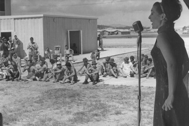 Diggers near the stage area at the 1st Logistics Support Base enjoy singer Geraldine Fitzgerald of the official Mar-Apr Queensland Easter Concert Party