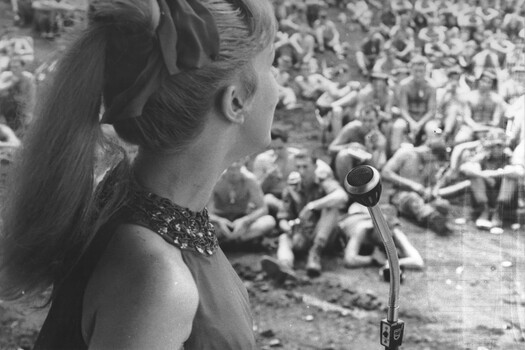 At the Official Sep-Oct 67 Melbourne Concert Party, Patty McGrath projects herself towards the Diggers at 1 ATF, Nui Dat, Luscombe Bowl. 