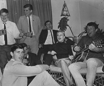 Rock and Roll stars Little Pattie and Col Joye entertain in the lounge room of a private home, members of Delta Company 6 RAR. 