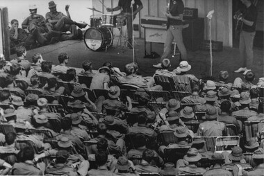 A Trio with the Official Mar-Apr 69 West Australian Concert Party play instrumental rock and roll numbers for the Diggers at 1st ATF Base. 