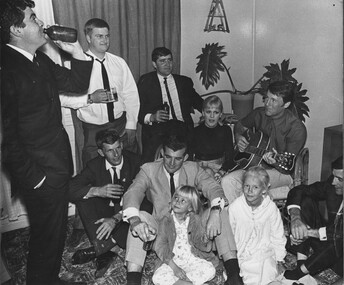 In Townsville, rock and roll stars Little Patty and Col Joye entertain in the lounge room of a private home.Members from Delta Company 6 RAR.