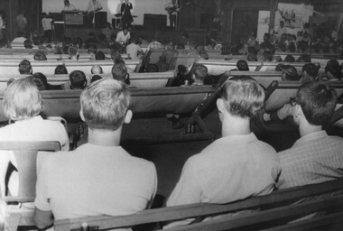 In the recreation building at the RAAF Base, Johnny O'Keefe and his rock and roll band perform a night show for RAAF Diggers.  